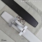 White leather belt with black keeper strap and silver-tone rectangular buckle.