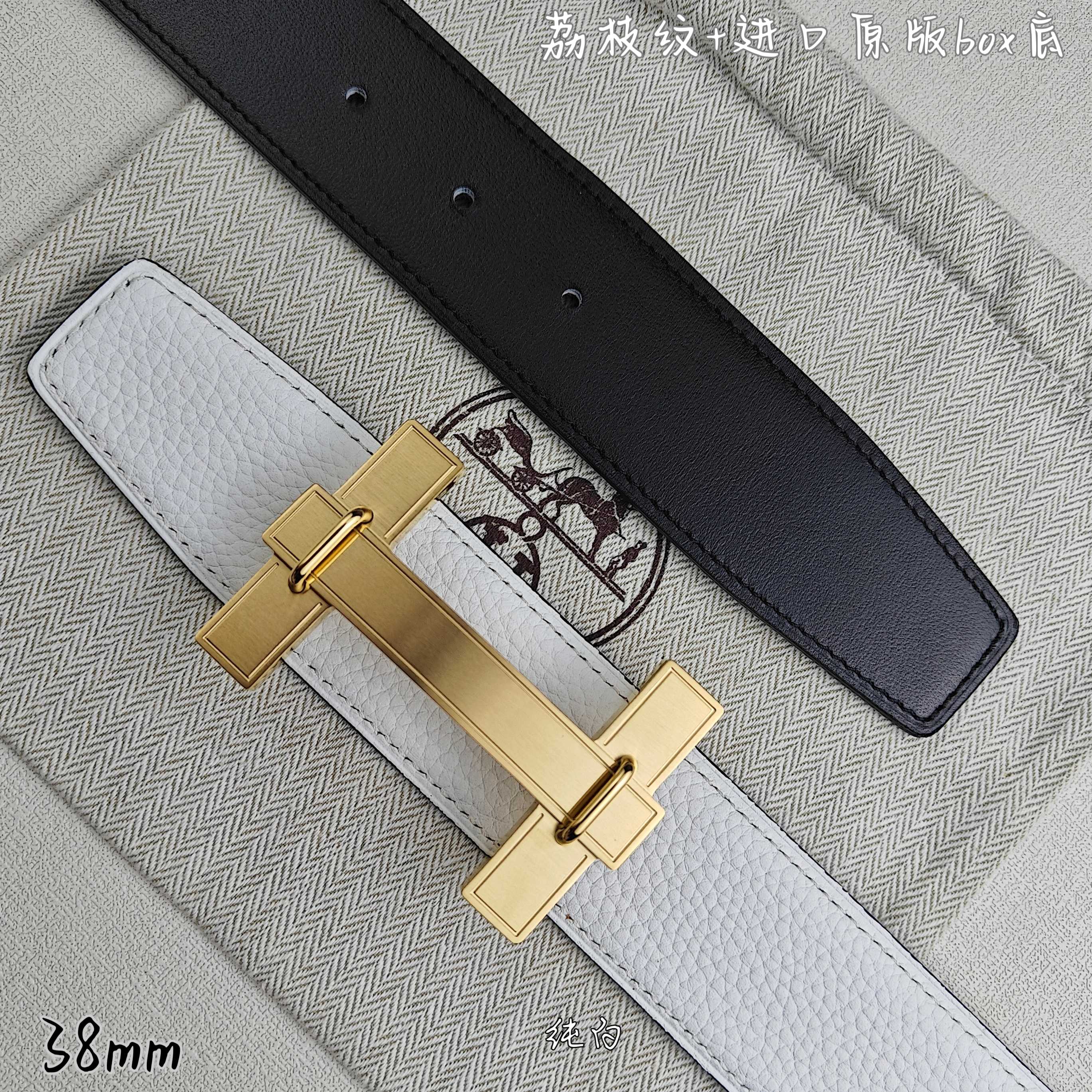 White leather belt with black keeper strap and gold-tone rectangular buckle.