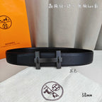 Leather belt with silver-tone rectangular buckle on dark strap