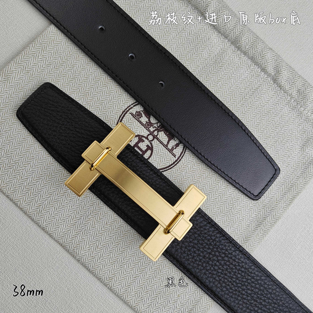 Leather belt detail: gold-tone H buckle on dark strap