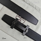 Leather belt detail: gunmetal-tone buckle on dark strap