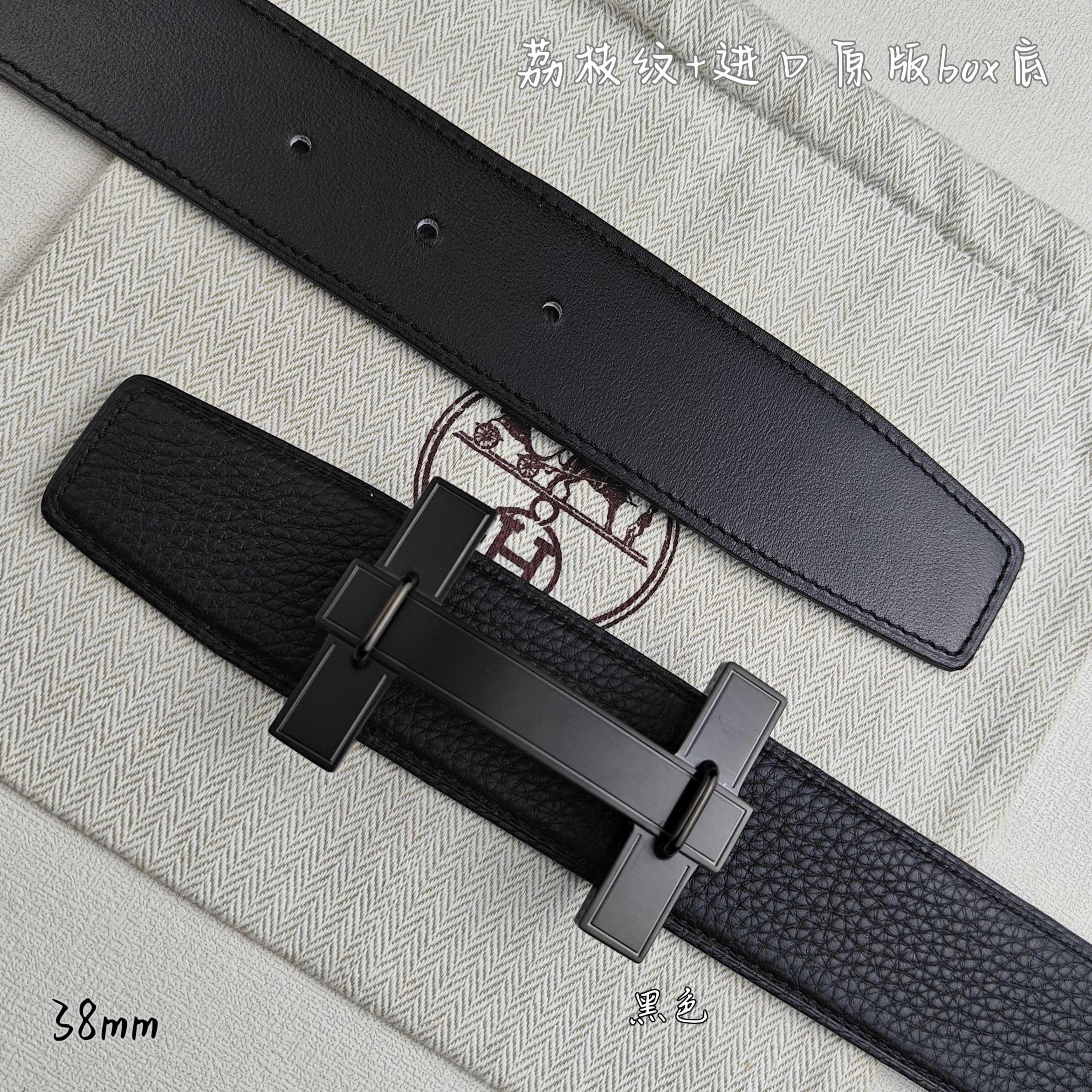 Leather belt detail: gunmetal-tone buckle on dark strap