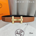 Hermes belt in tan leather with gold-tone buckle and double keeper straps.