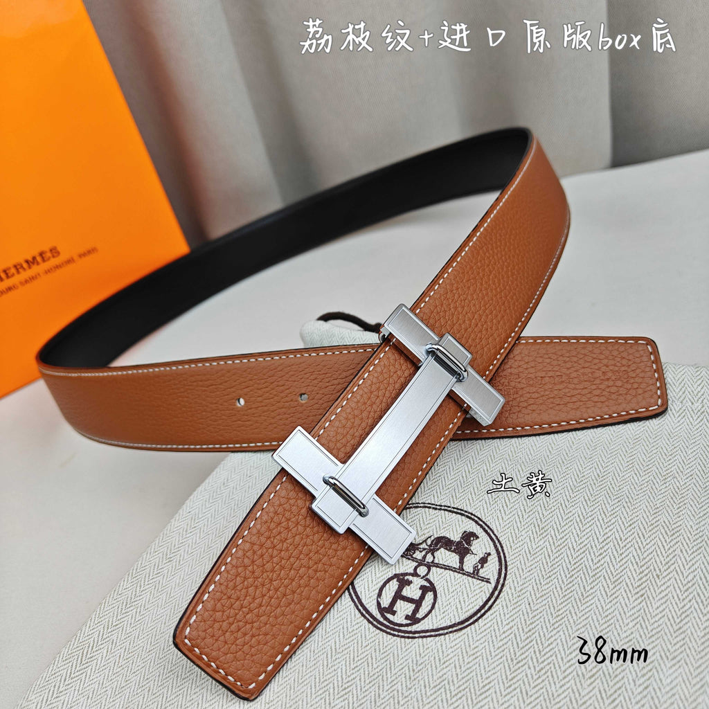 Hermes belt in tan leather with silver-tone buckle and crossbar keeper strap.