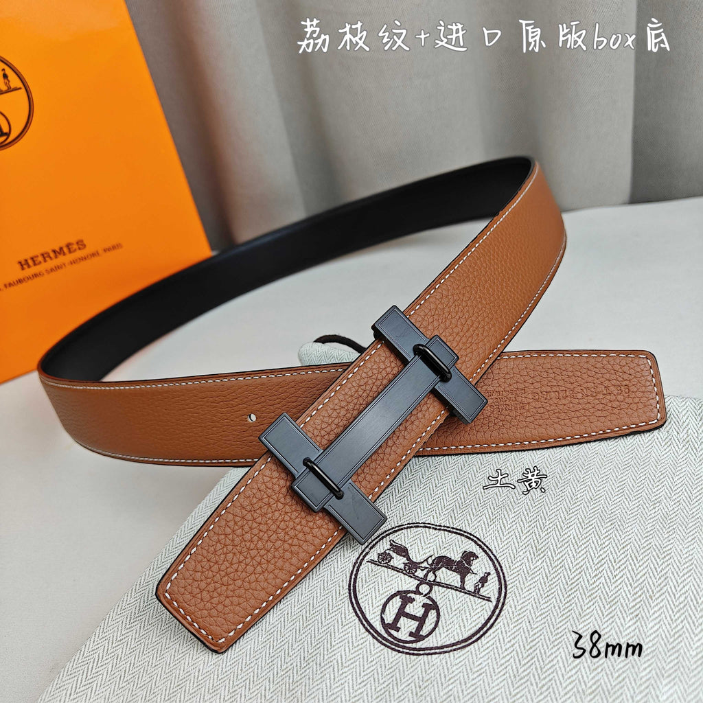 Hermes belt in tan leather with dark-tone buckle and crossbar keeper strap.