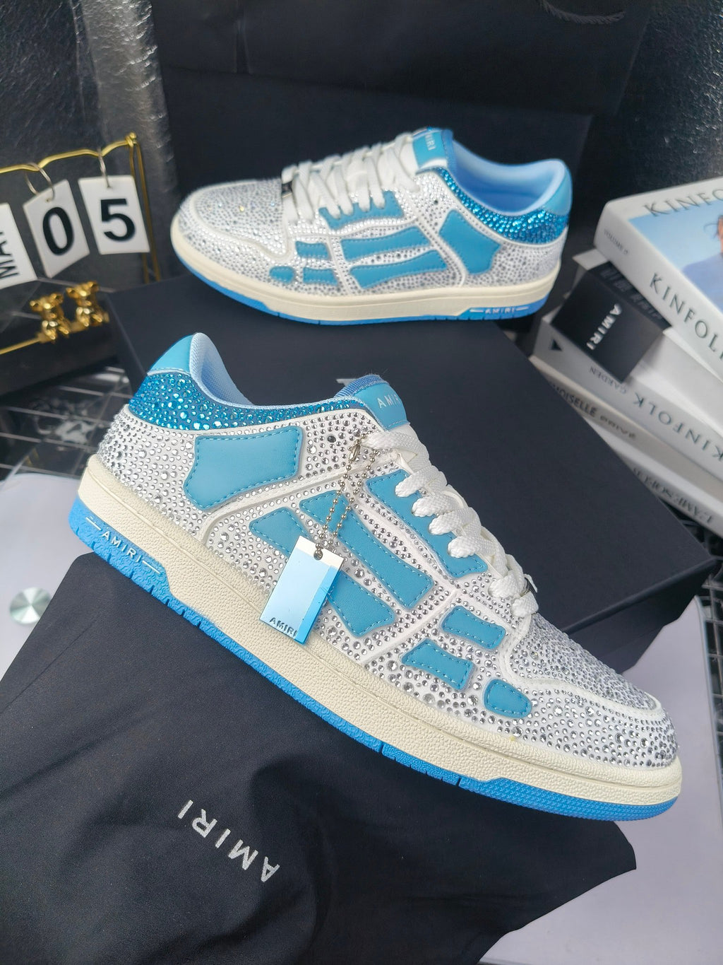 White and blue lace-up sneakers with speckled finish and blue trim accents