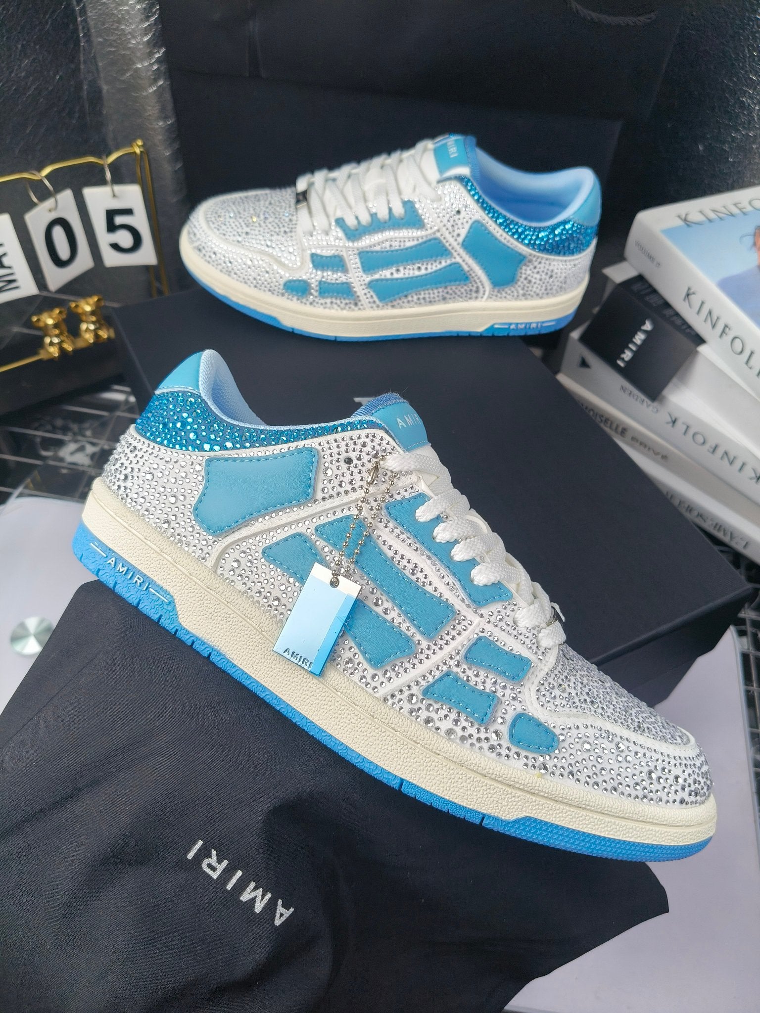 White and blue lace-up sneakers with speckled finish and blue trim accents