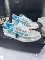 Blue and white low-top sneakers with rhinestone trim and lace-up front