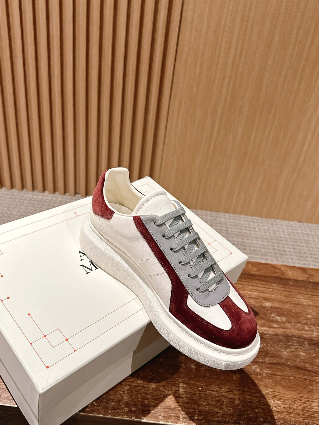 Alexander McQueen low-top sneakers with burgundy suede stripe, white leather and grey laces