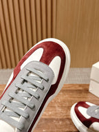 Alexander McQueen sneaker toe and lace area, burgundy suede upper on white leather