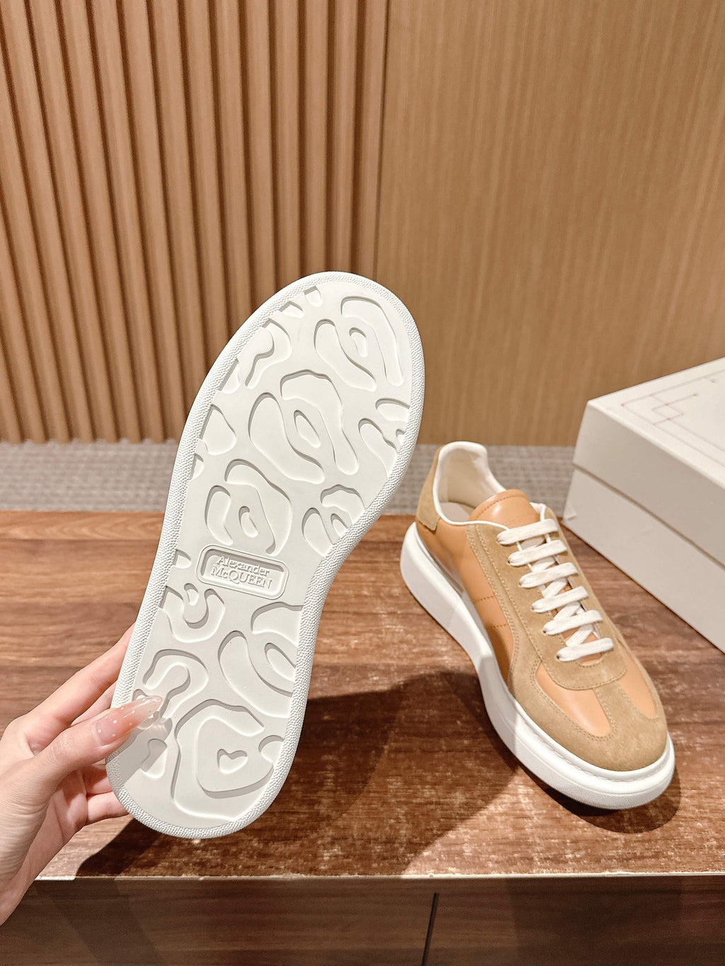 Tan lace-up sneaker with visible white treaded outsole