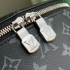 Louis Vuitton zipper pulls with LV engraved metal accents on monogram canvas