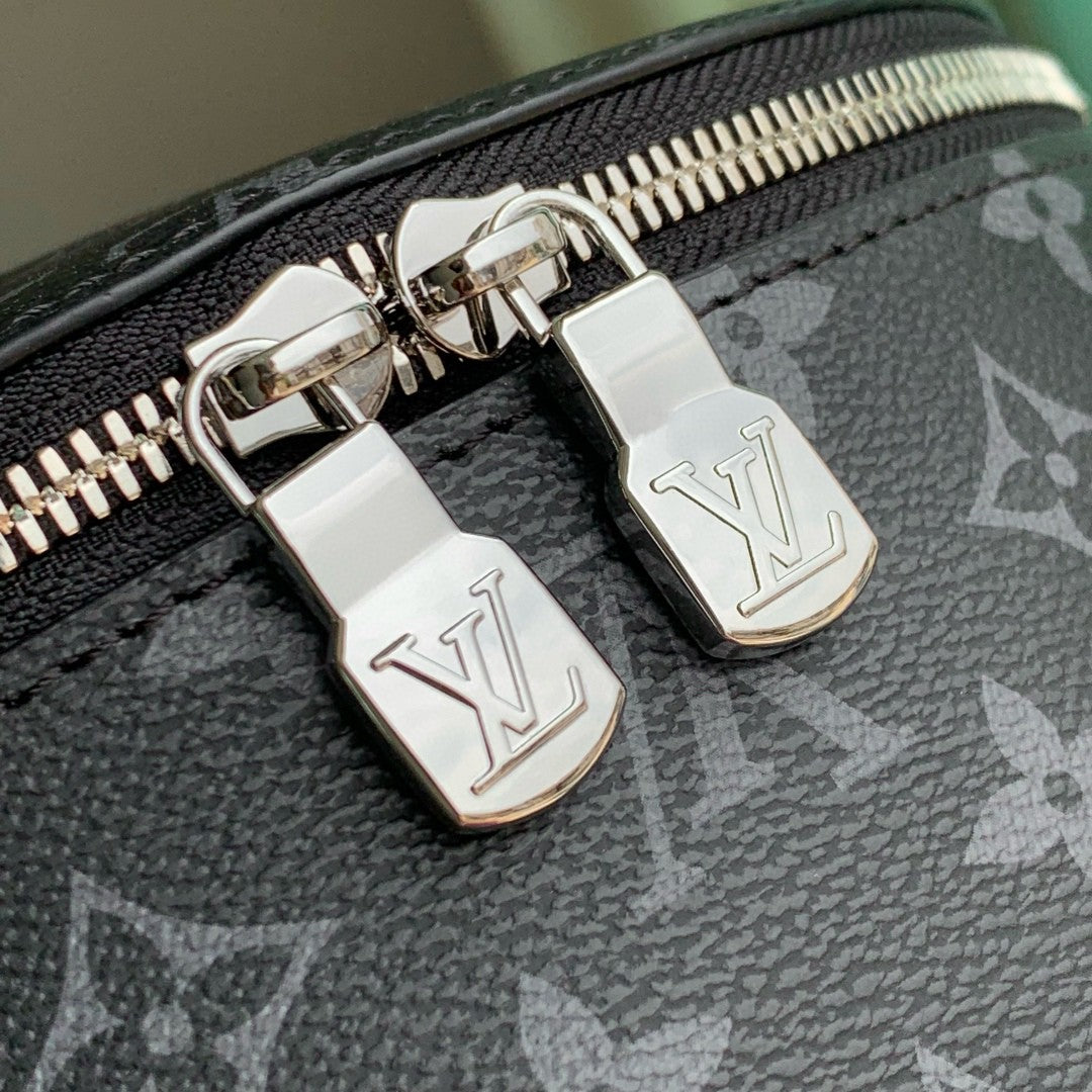 Louis Vuitton zipper pulls with LV engraved metal accents on monogram canvas