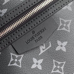 Louis Vuitton leather logo label on monogram canvas with silver zipper teeth