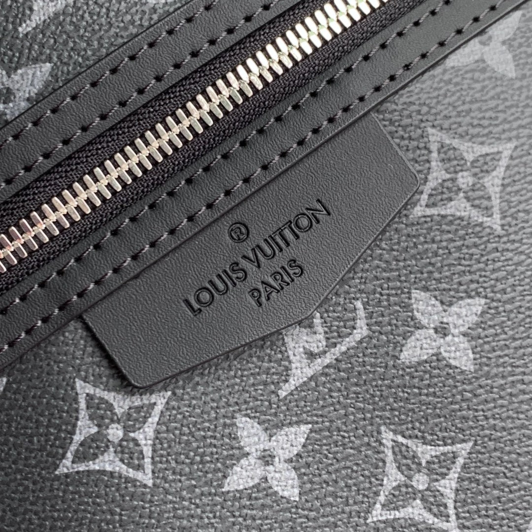 Louis Vuitton leather logo label on monogram canvas with silver zipper teeth