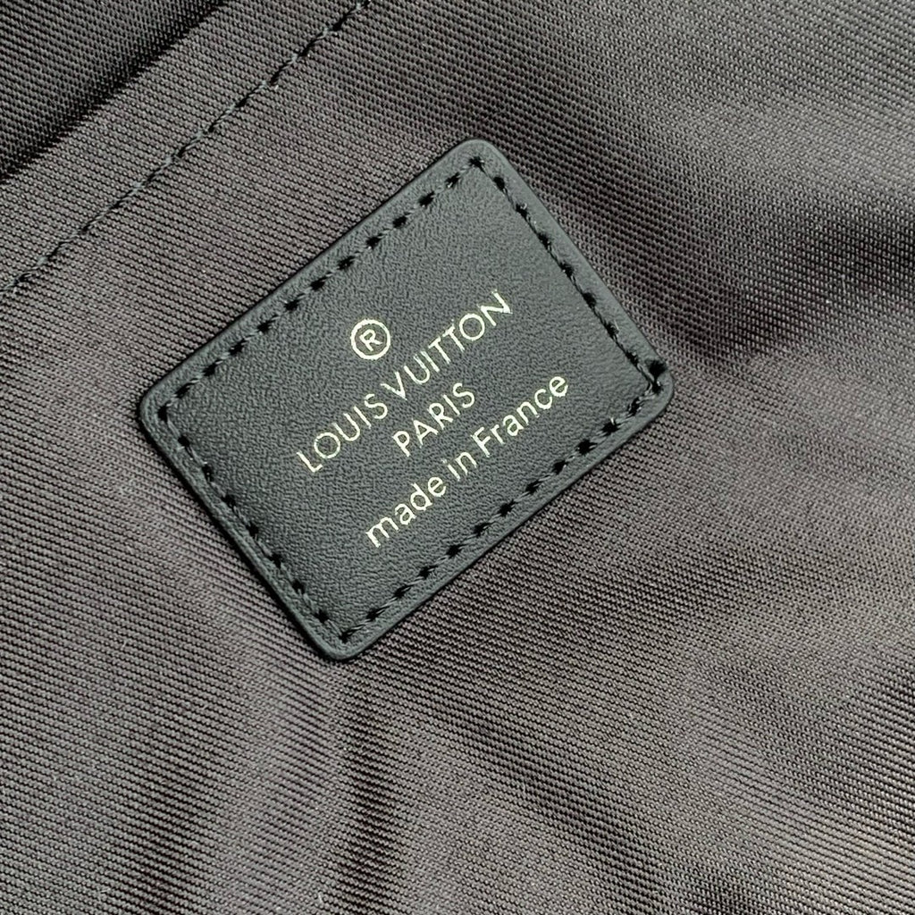 Louis Vuitton interior label reading "made in France" on monogram canvas