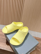 Balenciaga yellow slide sandals with open toe and contoured outsole