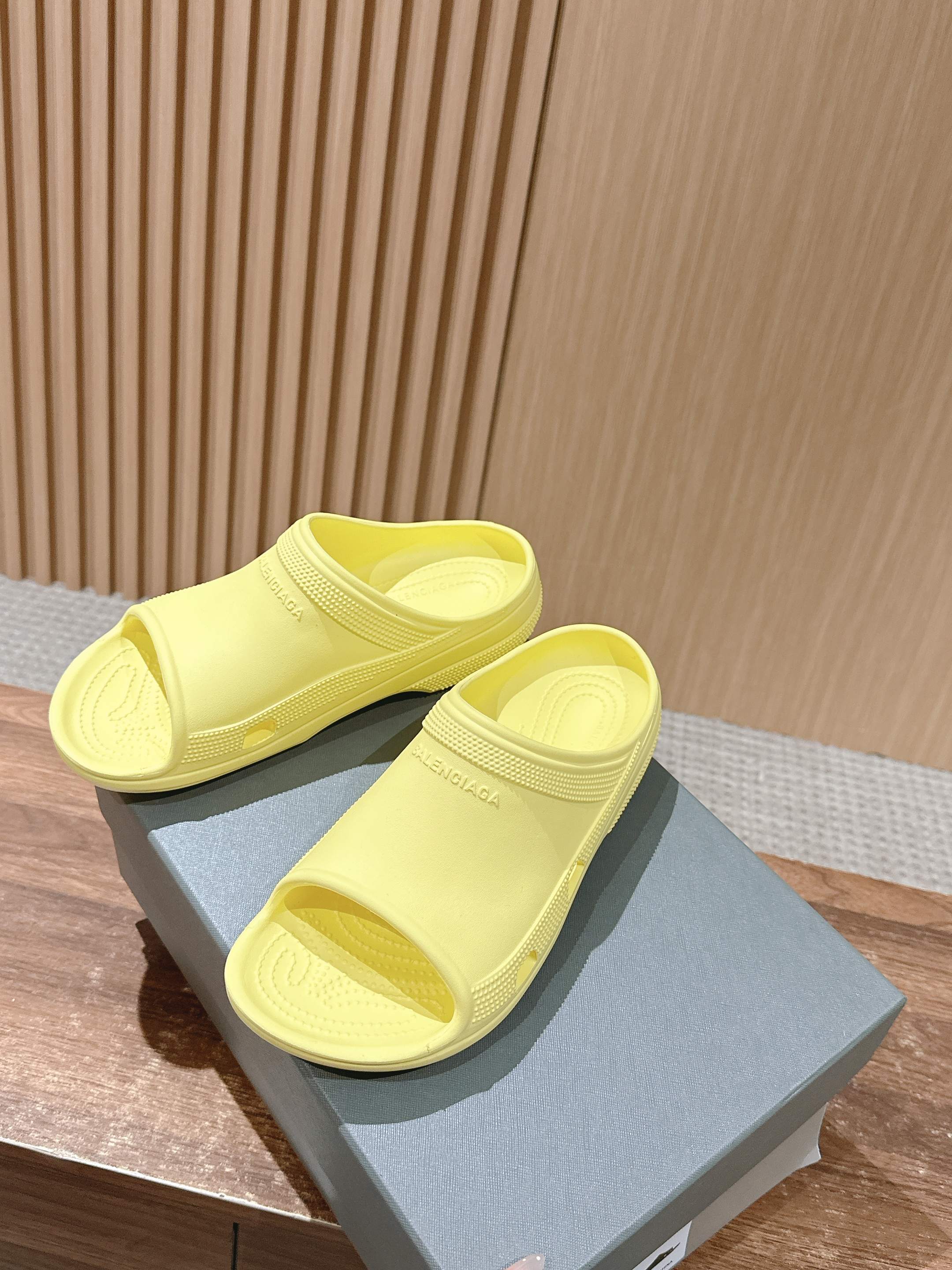 Balenciaga yellow slide sandals with open toe and contoured outsole