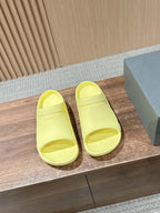 Balenciaga yellow slide sandals with open toe and molded footbed