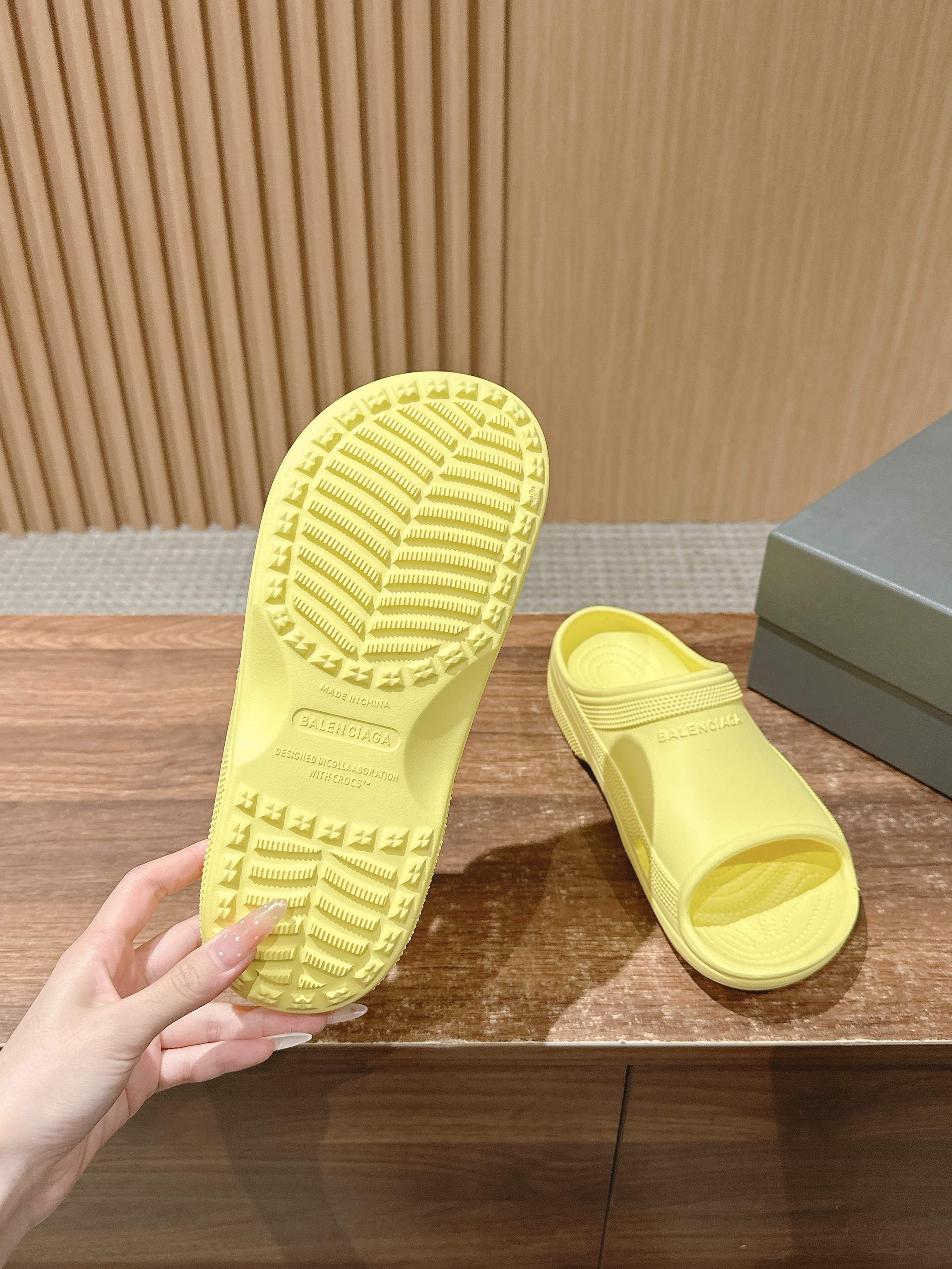 Balenciaga yellow slide sandals showing outsole and footbed details