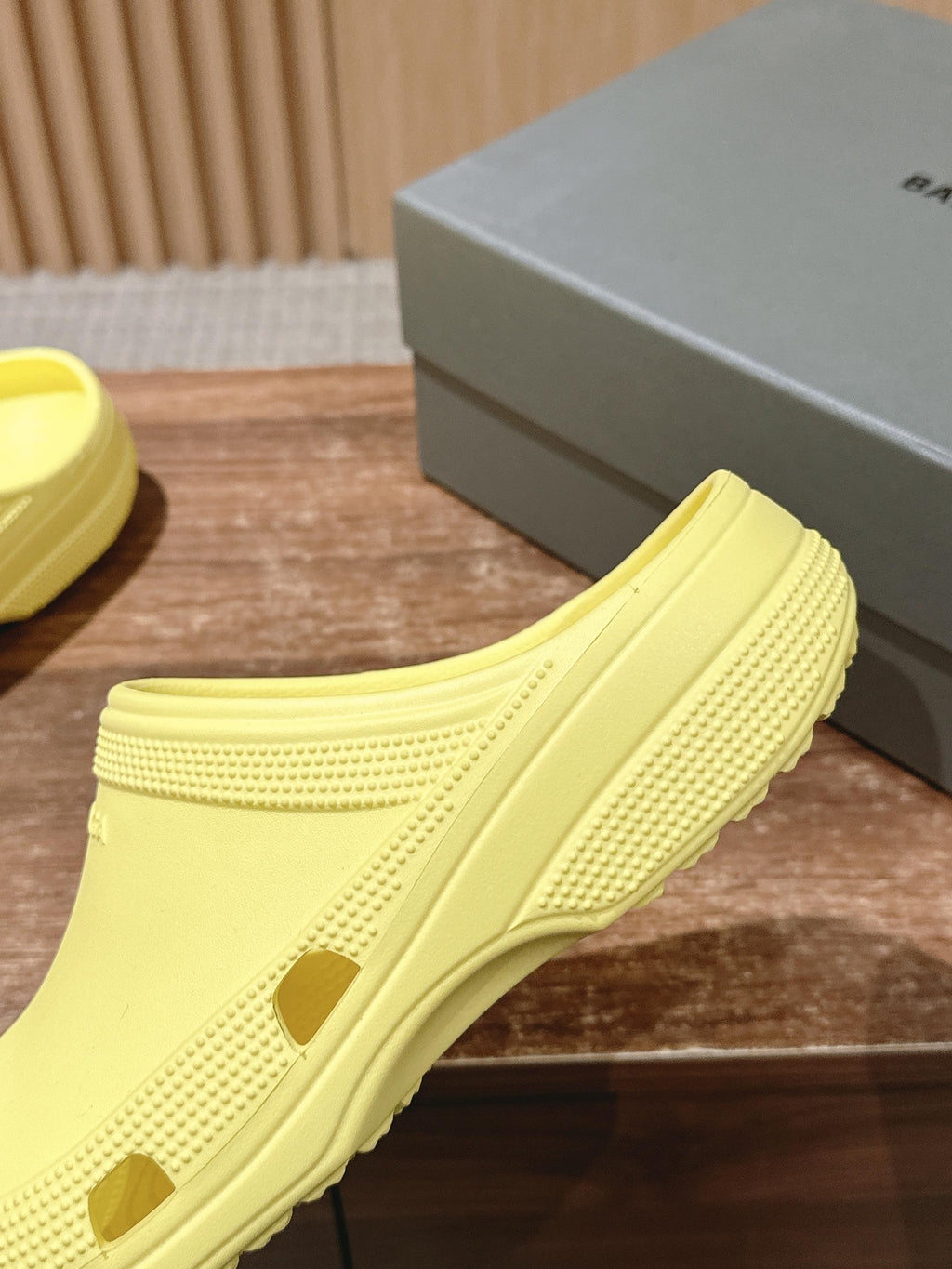 Balenciaga yellow slide sandal close-up of textured side and outsole pattern