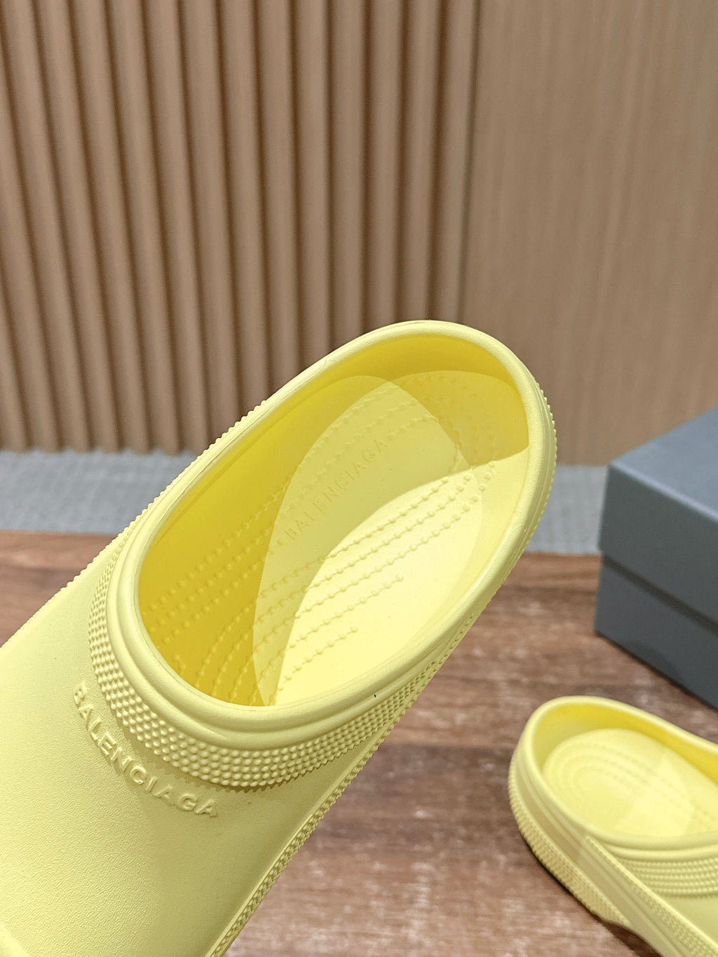 Balenciaga yellow slide sandal close-up, open top and molded interior