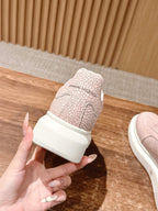 Pink sneaker heel with textured pattern and cushioned collar