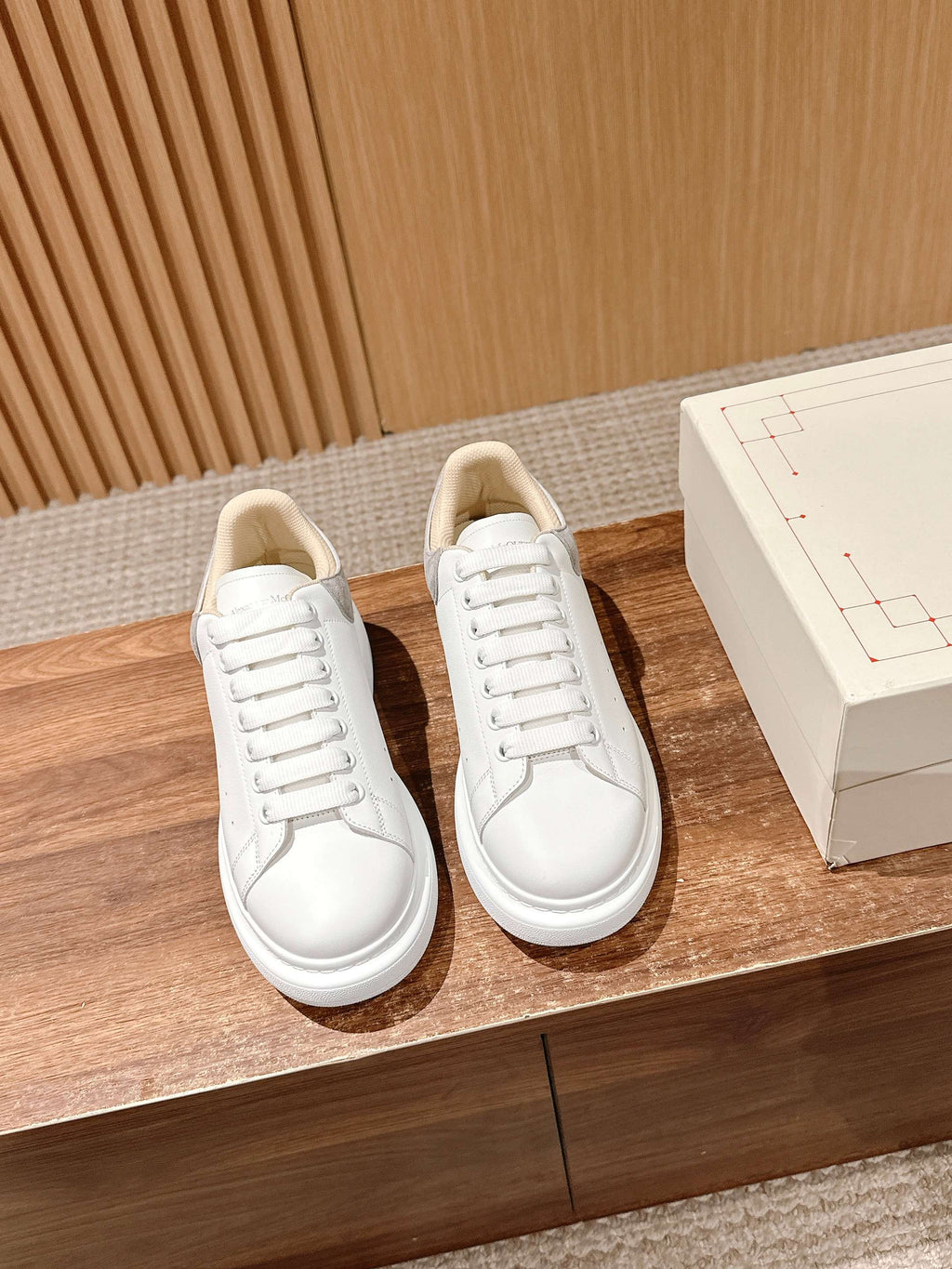 Alexander McQueen white lace-up sneakers with padded collar and perforated details