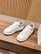 Alexander McQueen white low-top sneakers with white laces and smooth toe cap