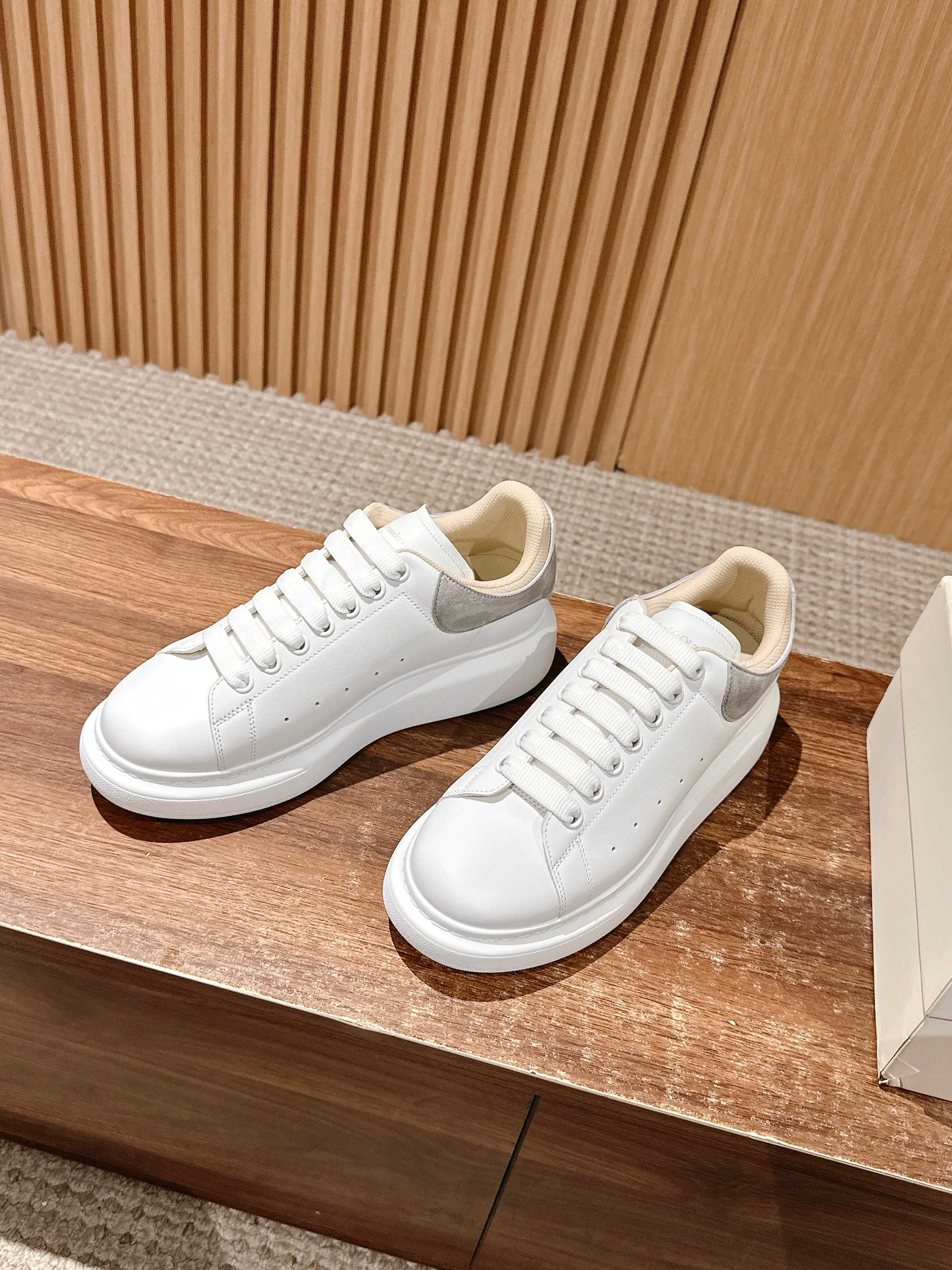 Alexander McQueen white low-top sneakers with white laces and smooth toe cap