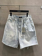 Light-wash denim shorts with drawstring tie, front pockets, and frayed hem