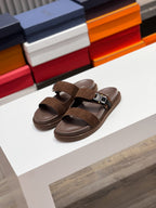 Brown Dior slide sandals with two suede straps and black buckle hardware