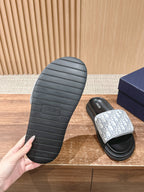 Dior slide sandal outsole with textured rubber and patterned foot strap