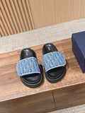 Dior slide sandals with blue logo straps and black footbeds