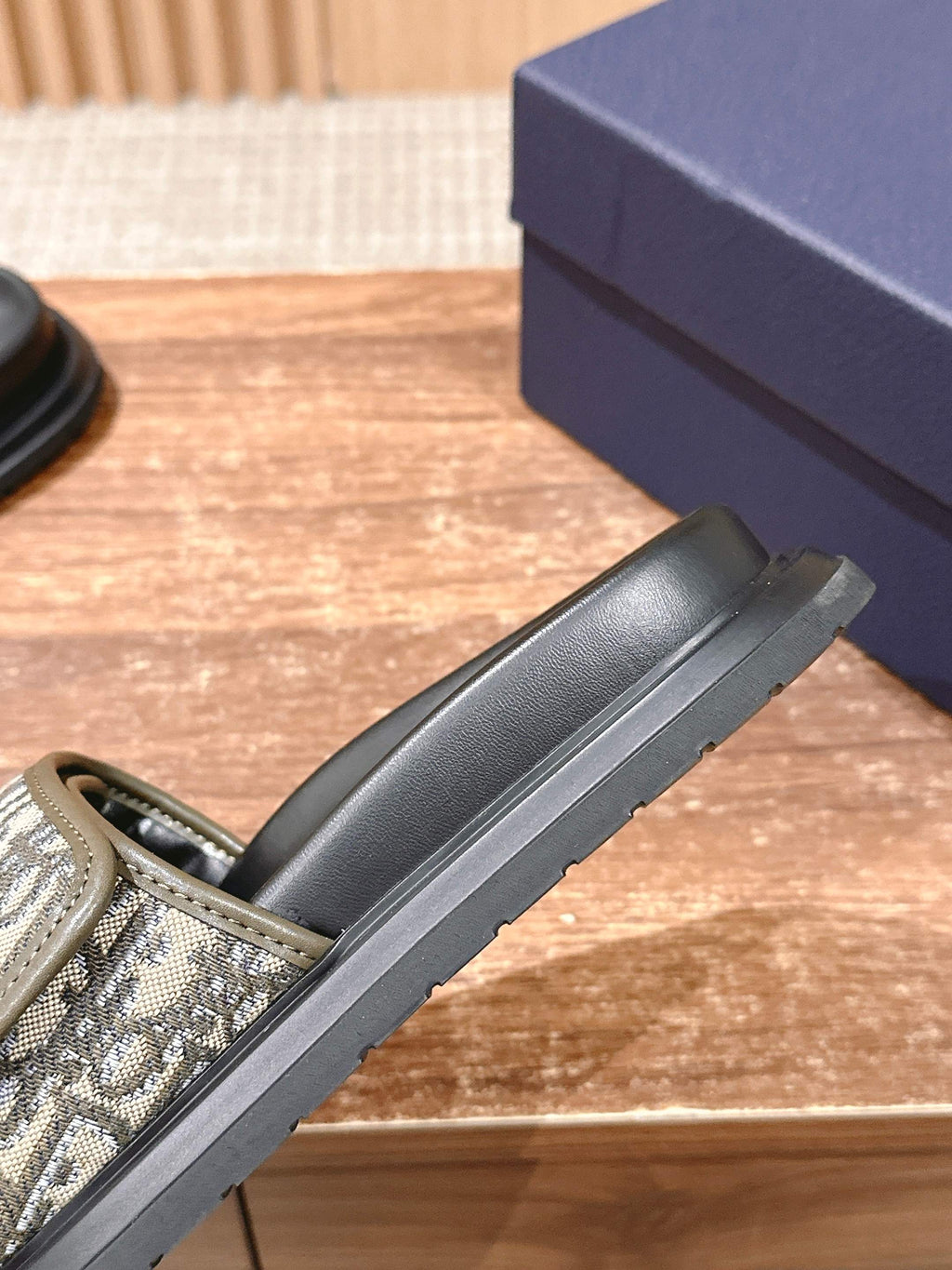 Black Dior slide sandal with beige Oblique strap and thick grooved sole