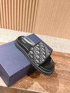 Dior slide sandals with black leather look footbed and Dior monogram strap