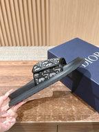 Dior slide sandals outsole side view with Dior monogram strap
