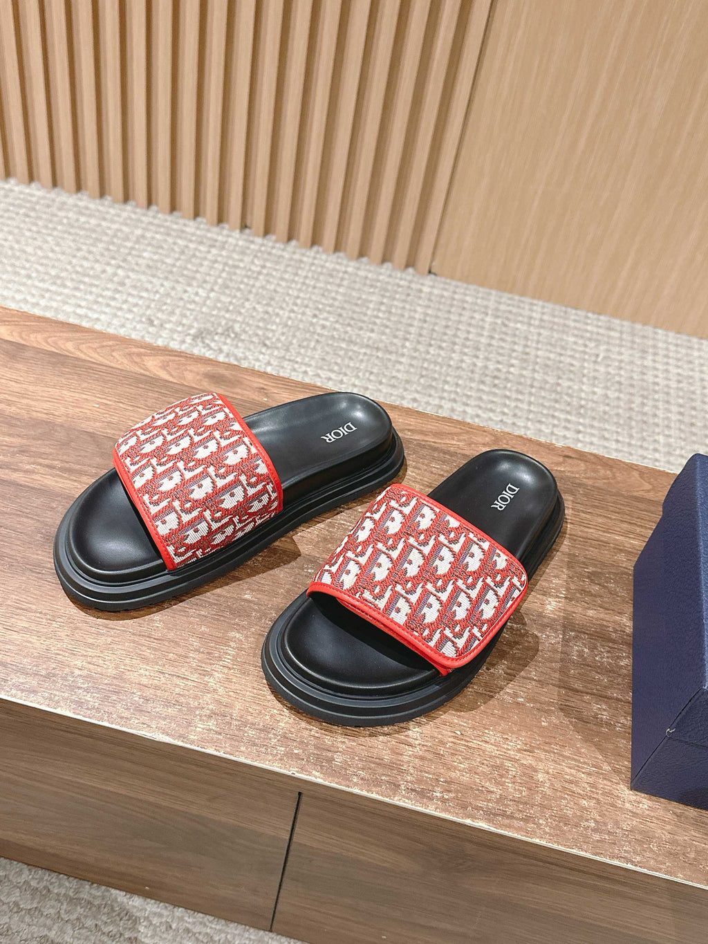 Dior slide sandals with red logo-print strap and black platform sole