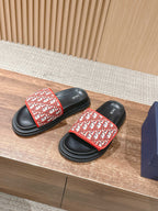 Dior slide sandals with red logo-print strap and black platform sole