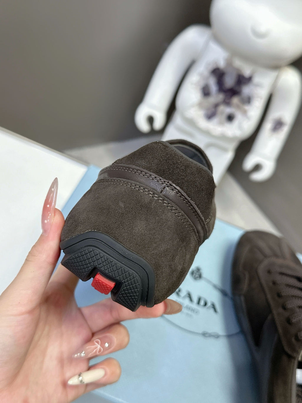 Prada unisex dark brown suede sneaker heel and textured rubber sole
