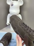 Prada unisex dark brown suede sneaker side view with lace-up panel