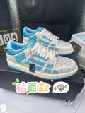 Blue and white low-top sneakers with rhinestone details, lace-up style