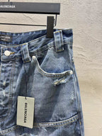 Blue denim shorts front view with belt loops, button closure, and logo hang tag