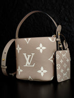 Louis Vuitton monogram bucket bag in light beige with white floral pattern and matching pouch