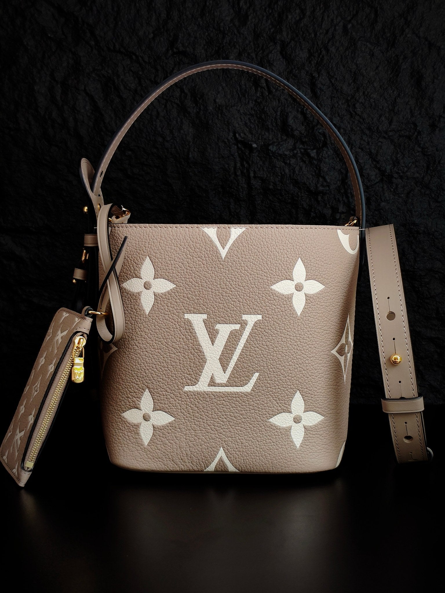 Louis Vuitton monogram bucket bag, light beige leather with white floral print, dual straps