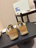 Back view of tan suede sneakers with tan heel and check-pattern lining