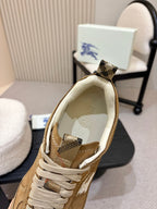 Tan suede sneaker showing check-pattern lining and fabric lace-up