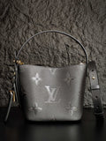 Louis Vuitton monogram bucket bag in gray with top handle and shoulder strap