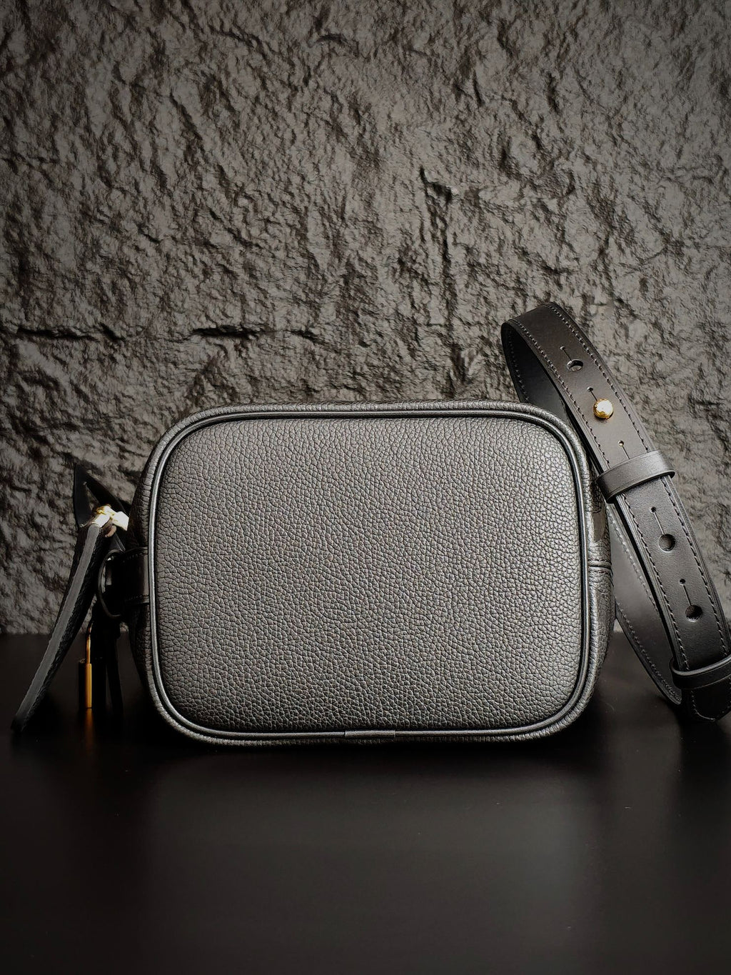 Louis Vuitton monogram crossbody bag in gray with rounded top and strap
