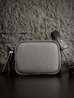 Louis Vuitton monogram crossbody bag in gray with rounded top and strap